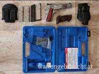 1911 Springfield + Originalkoffer + 4 Magazine + 1 Lederholster Sandwich + Magazinhols. + Aussenhols. + Sportgriffe + 1000. Schu