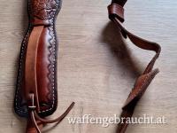 Hunter Gewehrriemen aus  Leder mit Schulterpolster  und Jagdmotiv