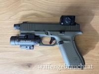 Glock 45 Hunter Edition mit Aimpoint COA, Timney Alpha Trigger und Olight Baldrian Pro