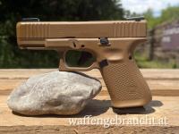 Glock 19 Gen 5 – Neuwertig (Cerakote Troy Coyote Tan, Performance Trigger, HiViz)