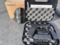 Glock 19 Gen. 4 mit Munition und Holster